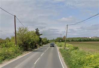 Road closed after crane ends up in ditch