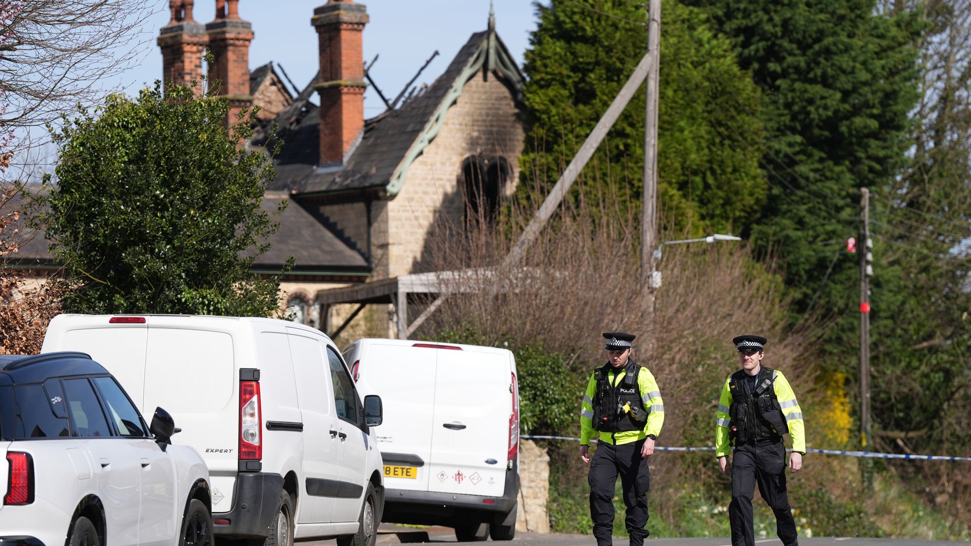 Man arrested on suspicion of murder after three die in house fire