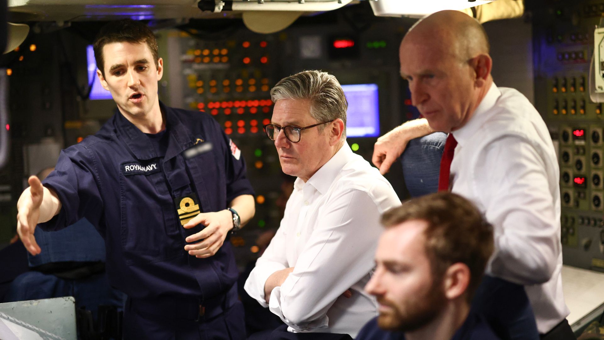 PM visits nuclear-armed submarine as tensions grow with Russia