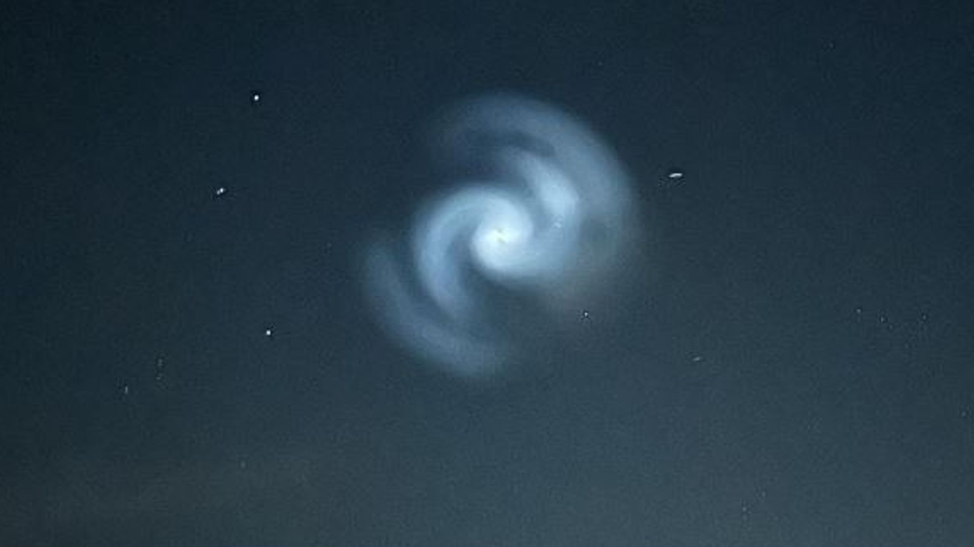 Glowing spiral appears in night sky – as experts share likely cause