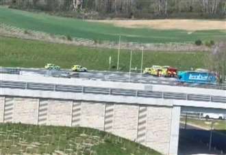 Emergency services called to overturned lorry at busy roundabout