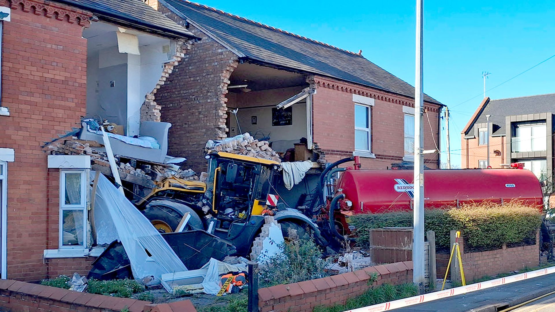 Mercedes driver arrested after collision involving tractor that crashed into houses