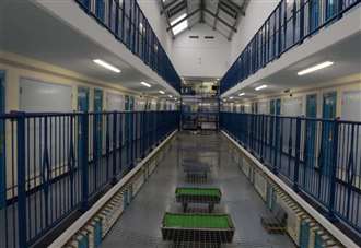 Prison governor accused of attacking and strangling inmate