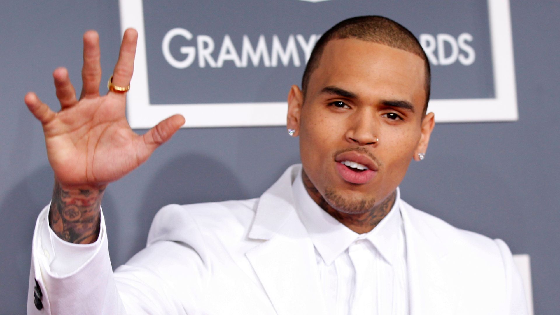 Rapper charged with GBH – after singer Chris Brown remanded in custody over ‘bottle attack’