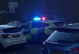 Woman taken to hospital after children seen ‘throwing stones and bricks’