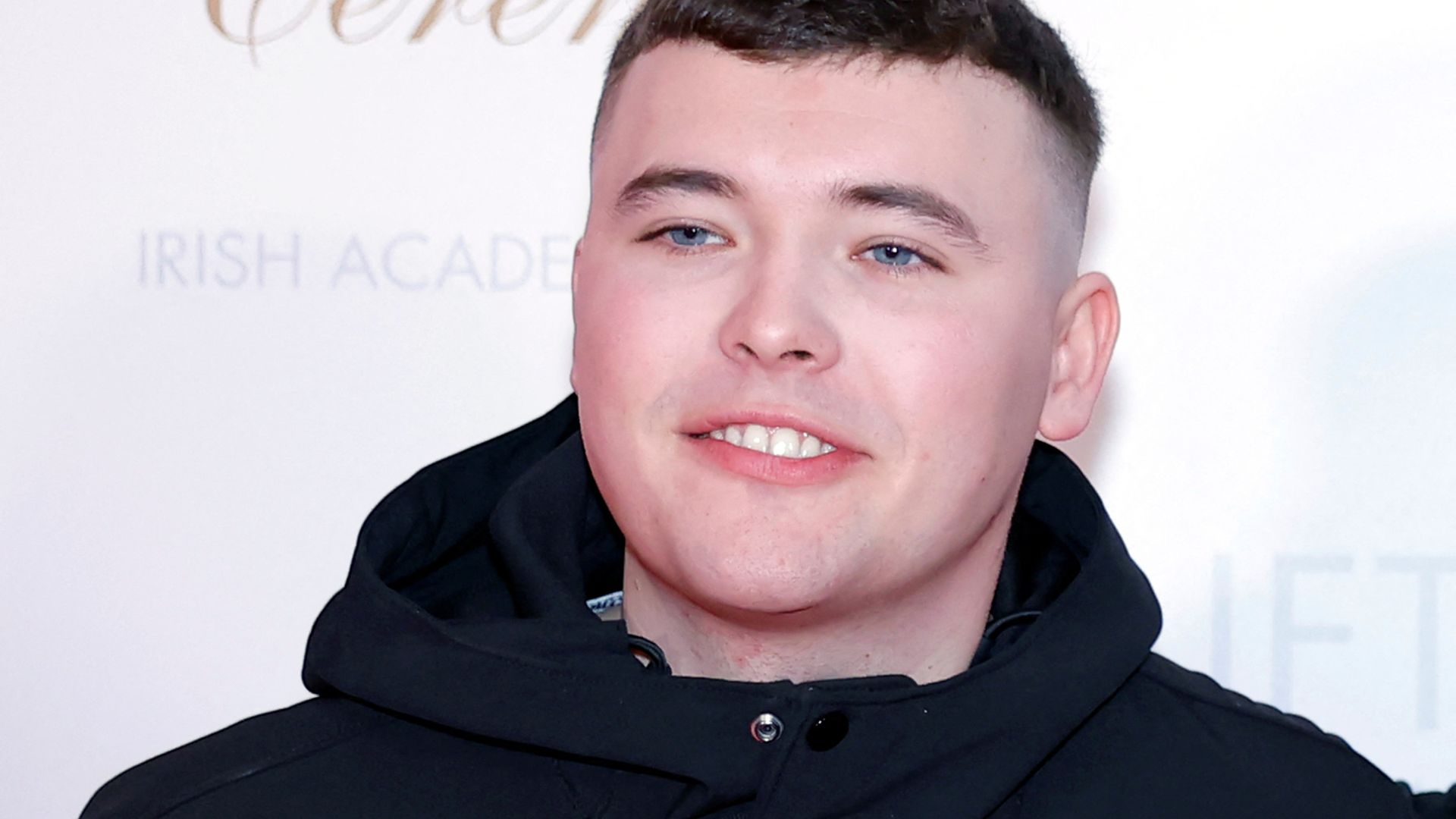 Kneecap rapper appears in court on terror charge – as protesters gather outside
