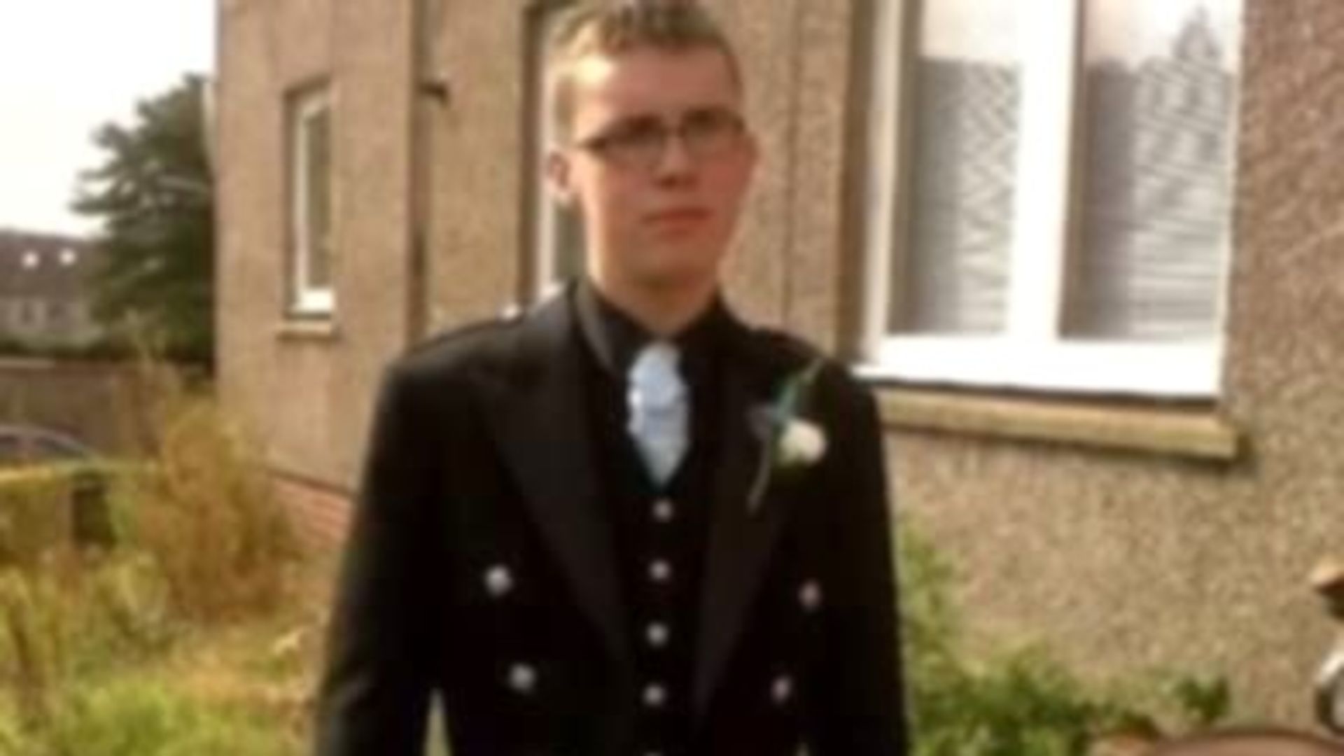 Two charged amid murder investigation after man found dead on road