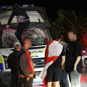 Protesters clash with police outside hotel believed to house asylum seekers