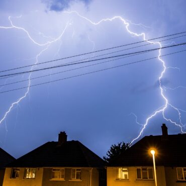 Thunderstorm warnings issued with risk of flooding as UK heatwave continues