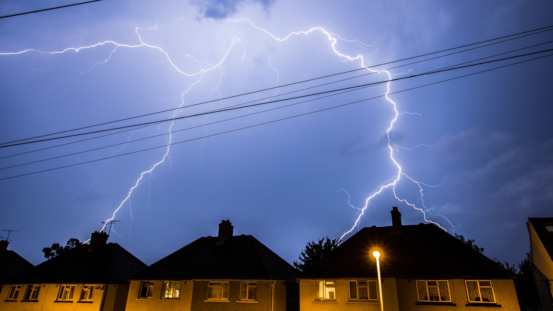Thunderstorm warnings issued with risk of flooding as UK heatwave continues