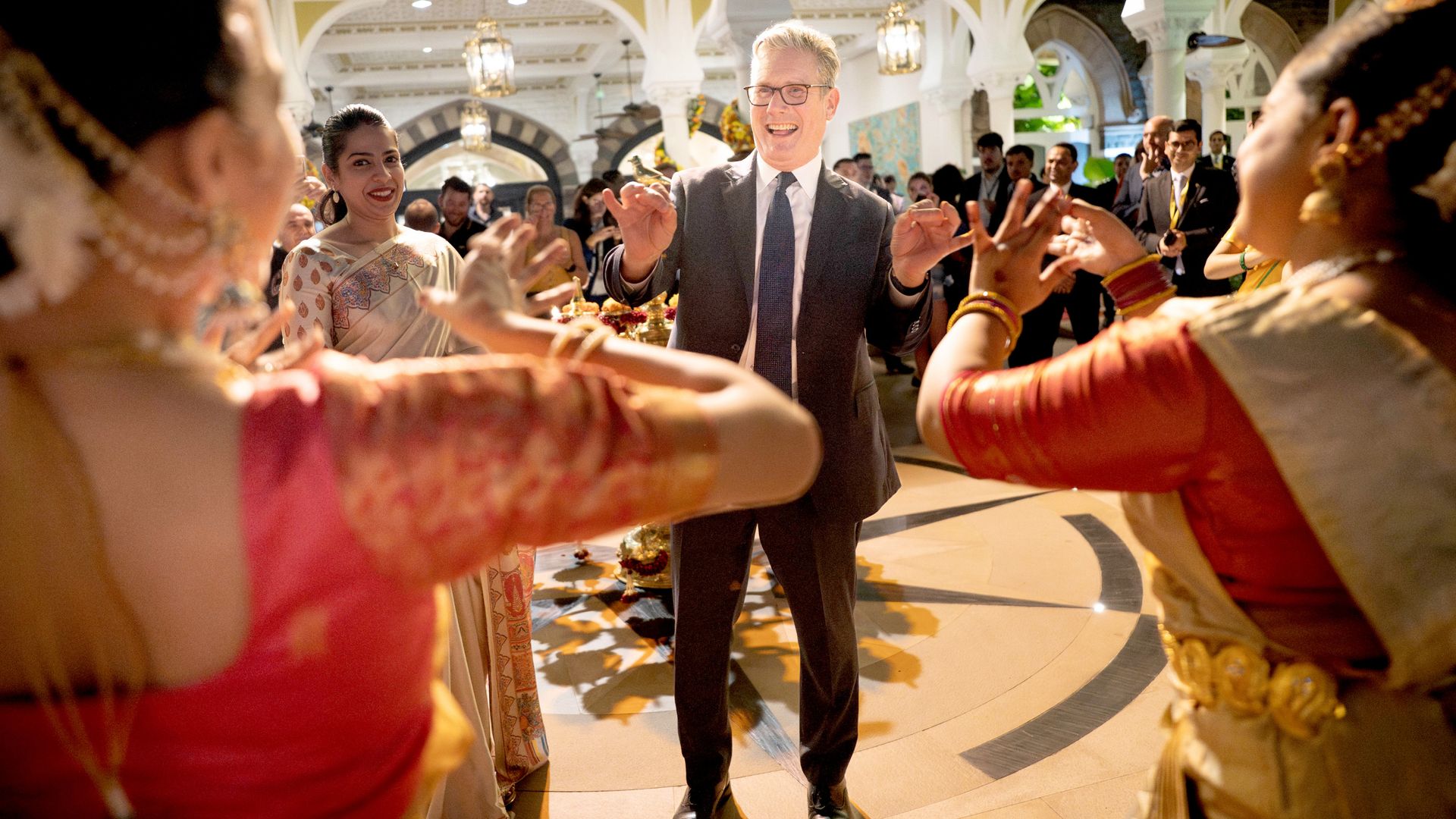 Starmer gets carnival welcome in India – but UK business leaders paint challenging picture back home