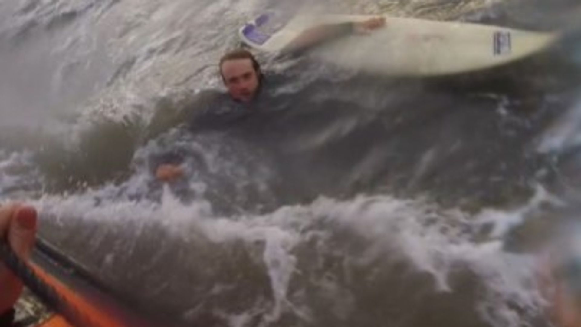 Video shows surfer being rescued after powerful rip current dragged him out to sea