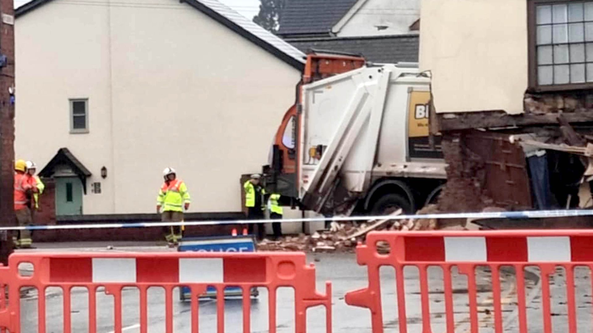 Bin lorry crashes into building, leaving one dead and two injured