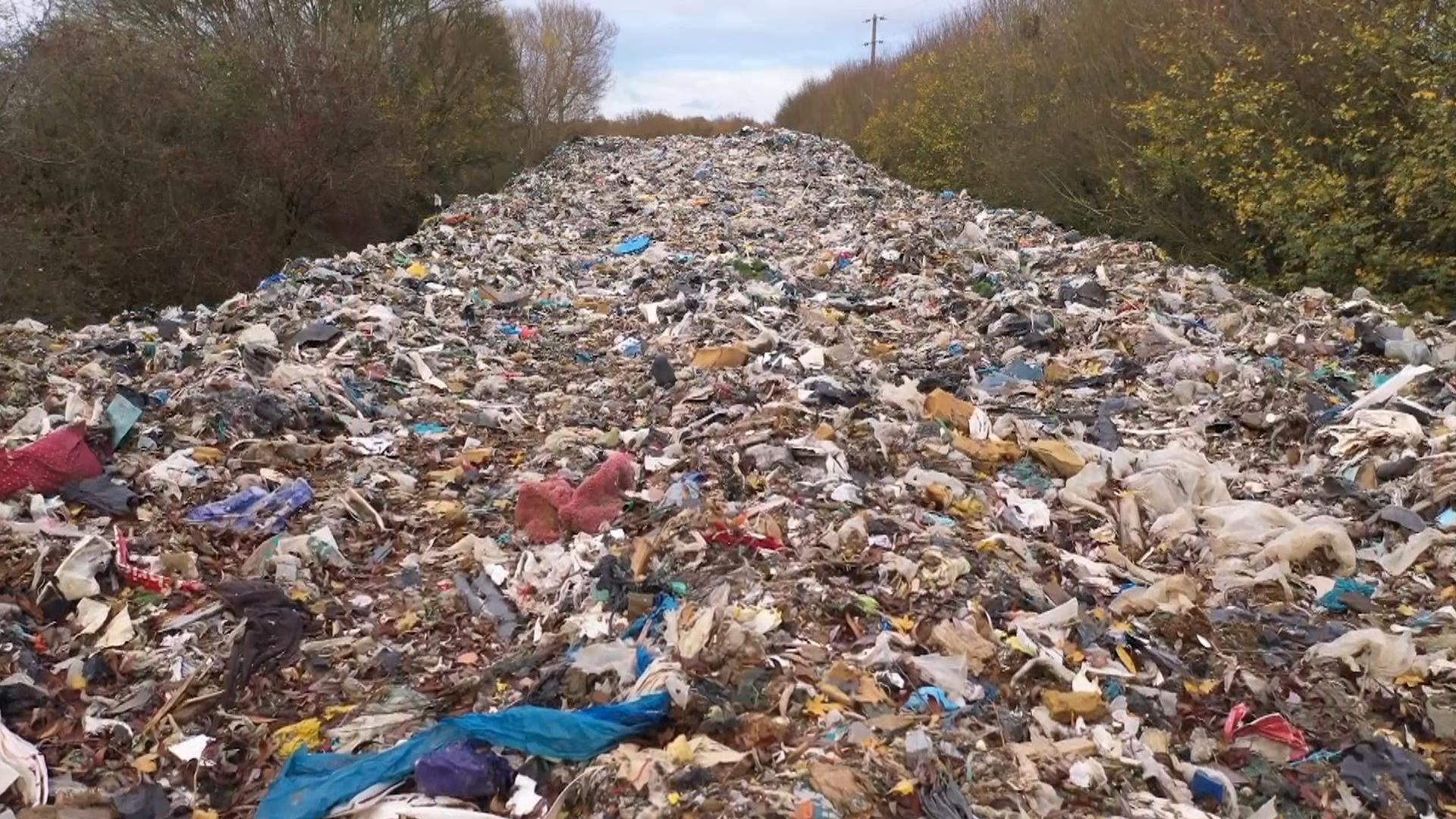 Drone footage shows scale of ‘revolting’ 60m-long mountain of waste next to river