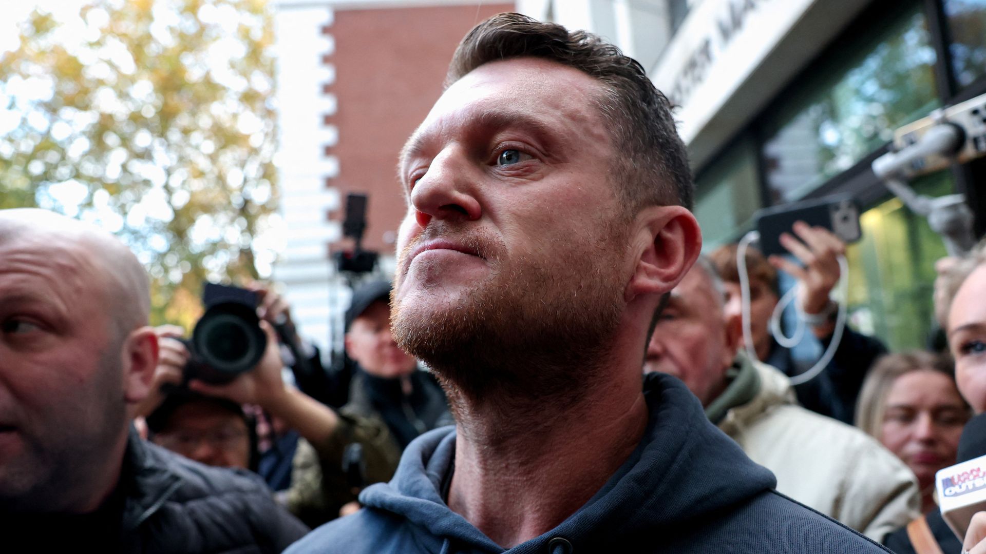 Tommy Robinson found not guilty of terror offence for failing to give police access to his phone