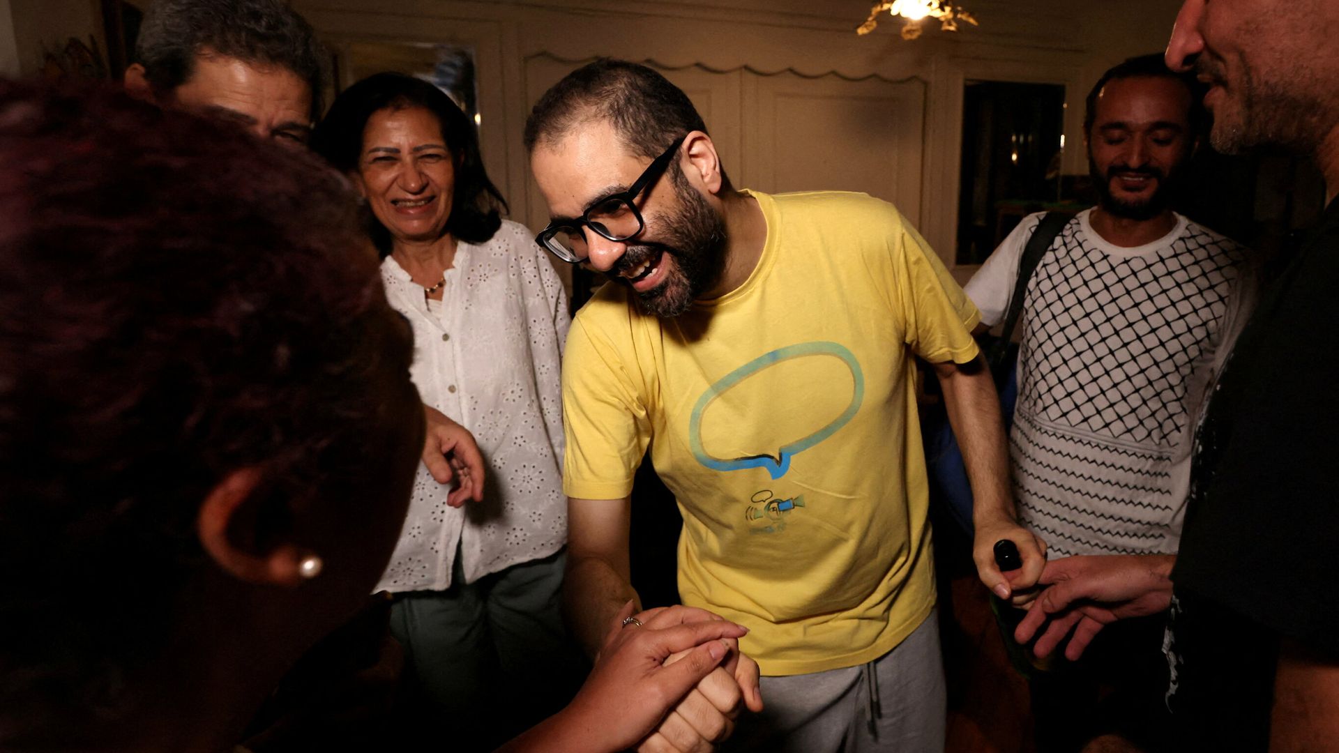 British-Egyptian activist returns to the UK and reunites with family after prison release