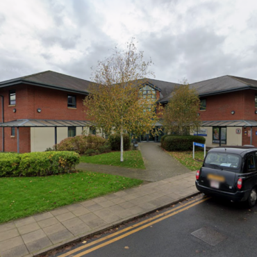 Man arrested after five people assaulted with weapon at a hospital