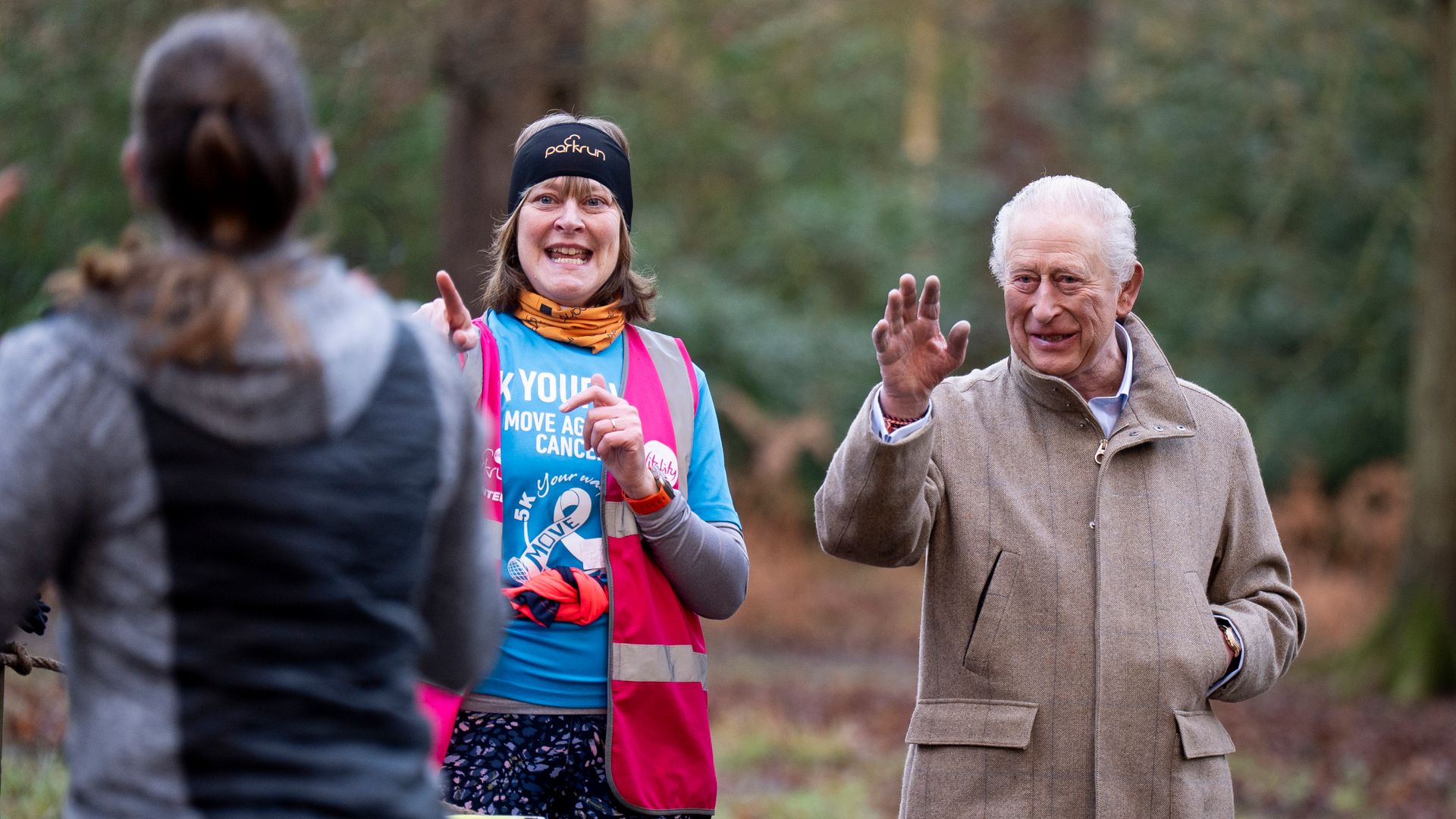 The King greets joggers in surprise appearance at cancer charity parkrun