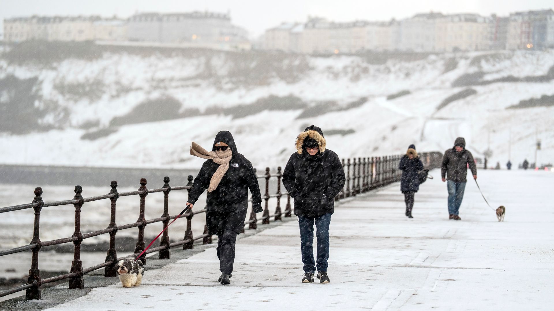 Flights cancelled and schools closed as new cold weather warnings issued across UK