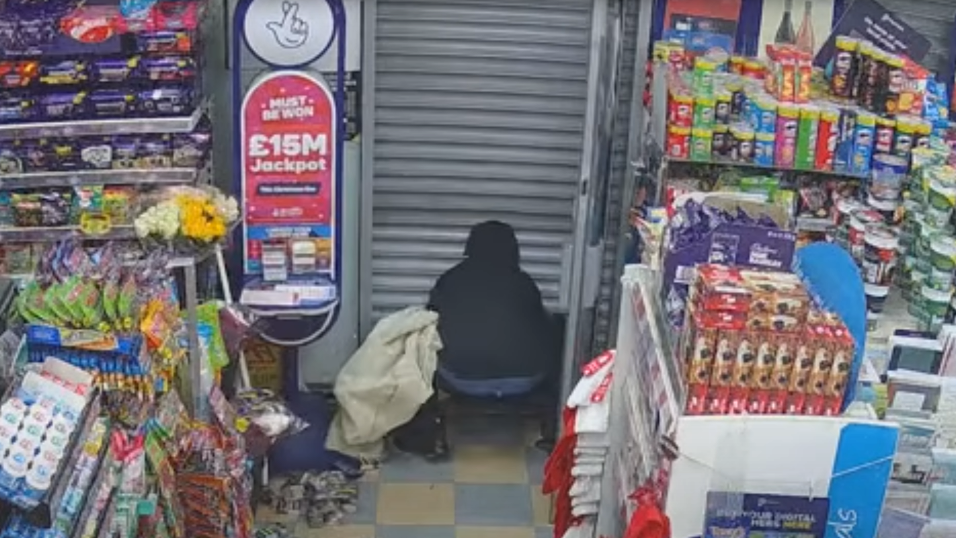 ‘Incredibly brave’ man traps armed robber inside shop