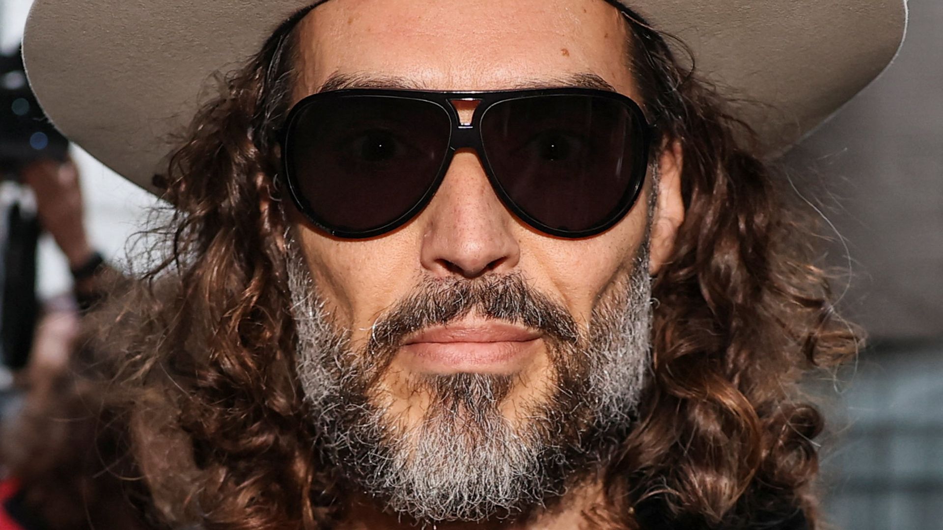 Russell Brand’s rape trial delayed for six months