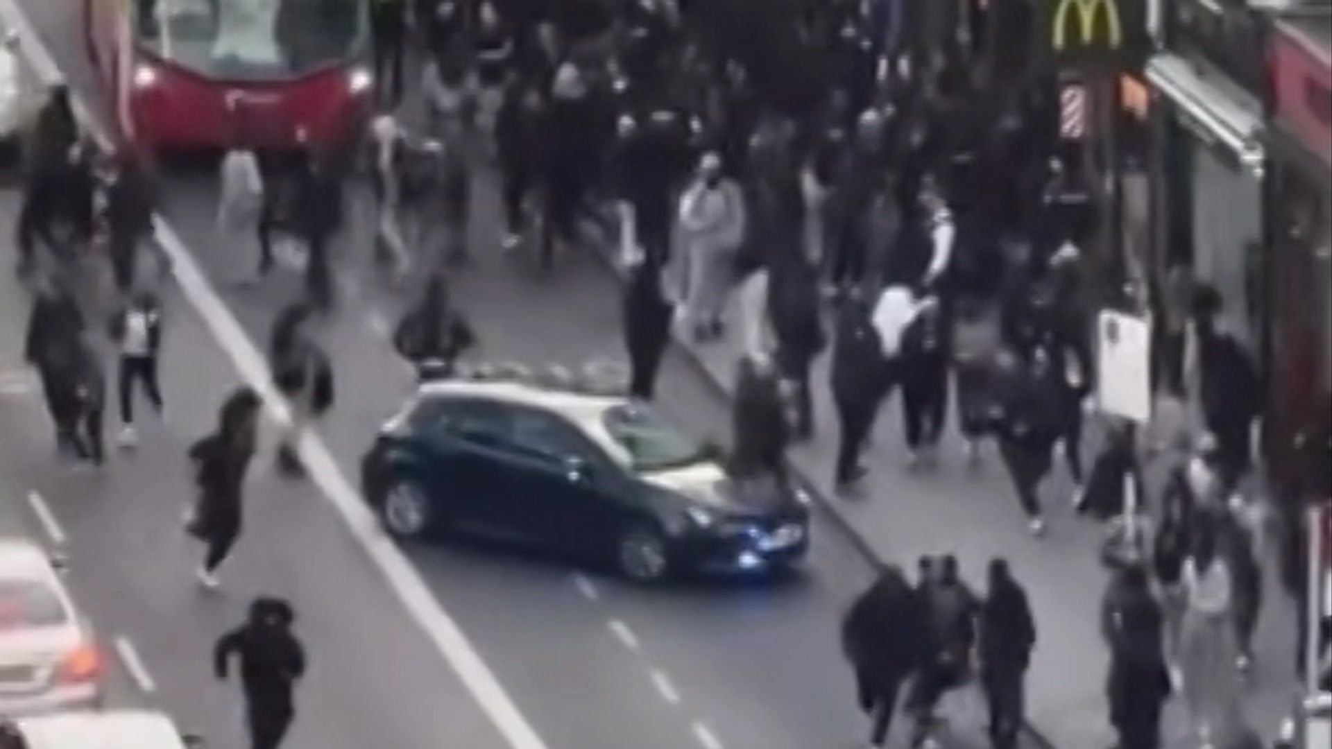Two arrested after crowds flood high street in social media craze