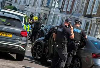 Man, 23, arrested after armed police descend on residential street