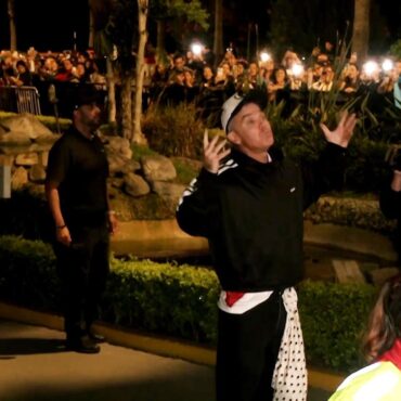 Robbie Williams sings with fans outside hotel after show cancelled in Peru
