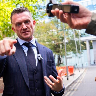 Tommy Robinson appears in court over alleged harassment of two journalists