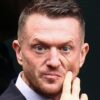Tommy Robinson found guilty of harassing two journalists